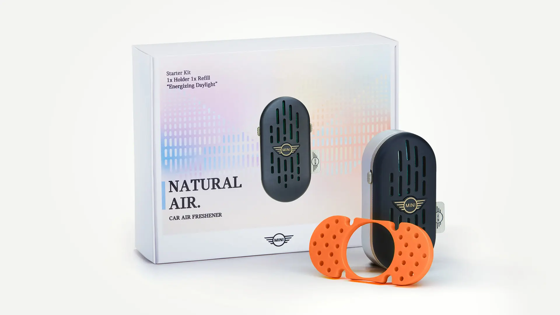 Pakkebilde av MINI Natural Air-startsettet for duftspreder til bil, som omfatter duftholder og -pinne.