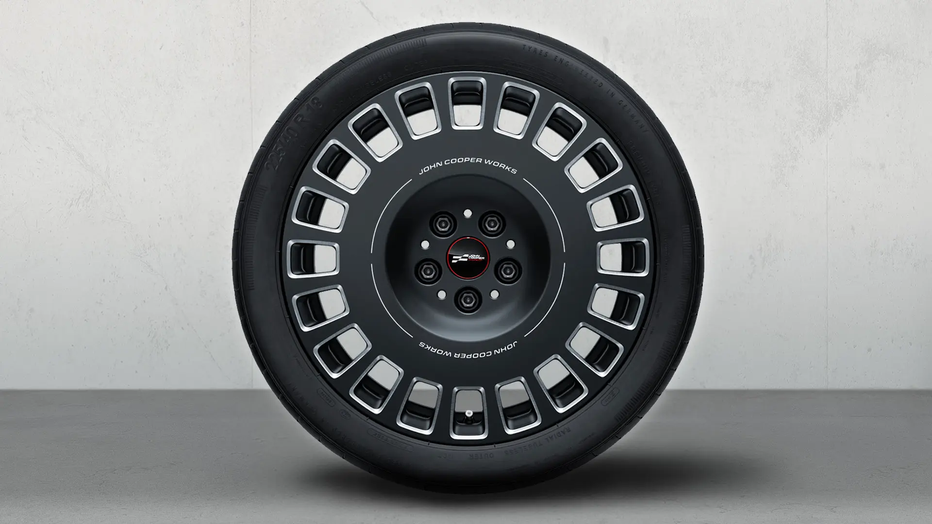 18” JCW Rallye eiker 992 hjul, med JCW-logoen og tofarget design i Frozen Midnight Grey og glansfrest finish.
